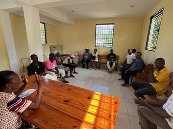 Herns Marcelin meeting with a cooperative in Haiti.