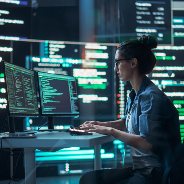 A woman coding on the computer