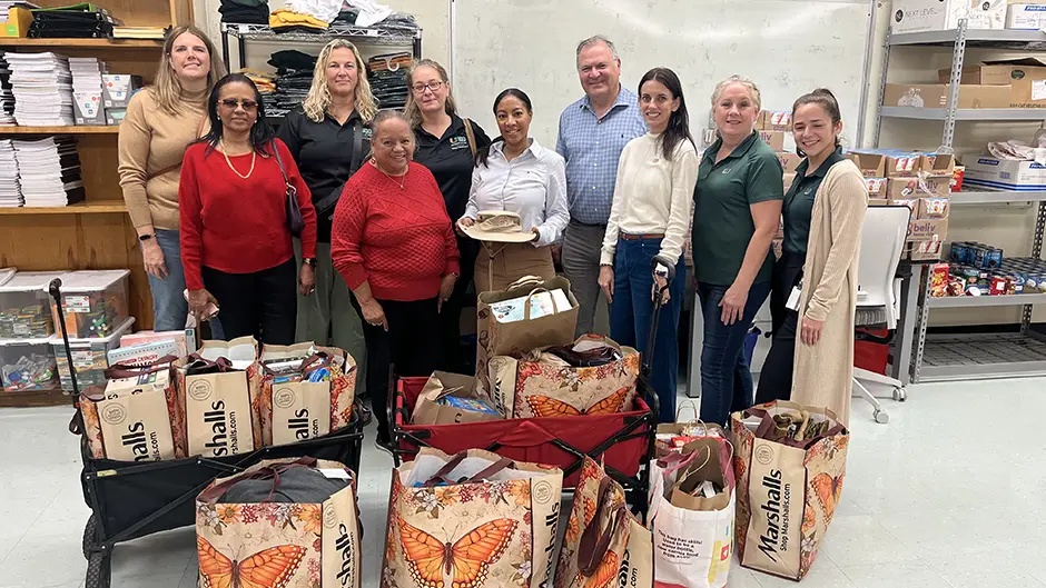 Dean Leonidas Bachas and staff drop off donations