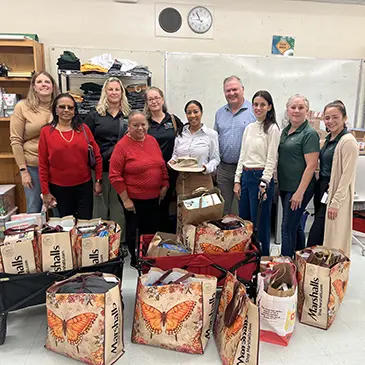 Dean Leonidas Bachas and staff drop off donations 