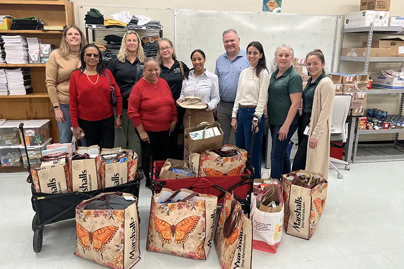 Dean Leonidas Bachas and staff drop off donations 