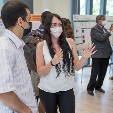Victoria Andre, College of Engineering graduate student at the Department of Biomedical Engineering, presents her research to Dr. Alsafrjalani from the Department of Electrical and Chemical Engineering.