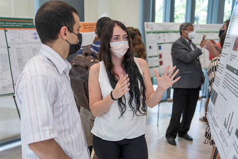 Victoria Andre, College of Engineering graduate student at the Department of Biomedical Engineering, presents her research to Dr. Alsafrjalani from the Department of Electrical and Chemical Engineering.