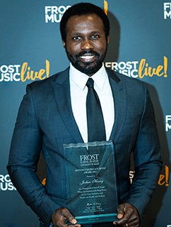 Joshua Henry with Award