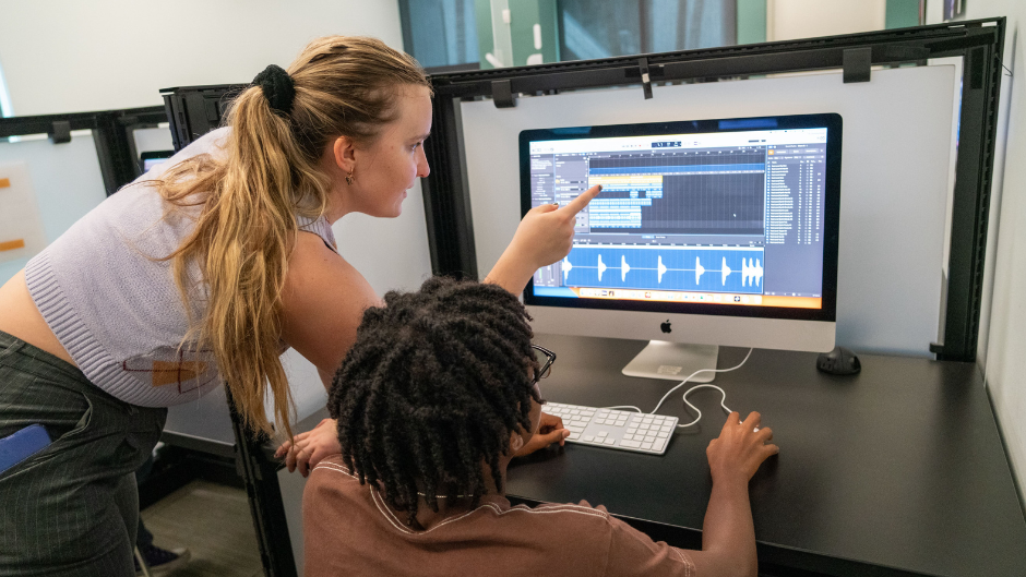 CHAI member Amanda Pasler teaching a MusicReach student about AI and music. Photo by Gonzalo Mejia/Frost School of Music.