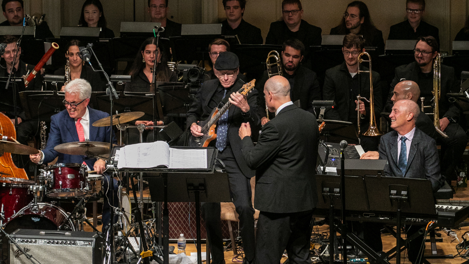 (left to right) Drummer Gregg Field, guitarist Dean Parks, conductor Scott Flavin (back to camera), and Dean Shelly Berg performing with the Henry Mancini Institute Orchestra at the Library of Congress. Photo courtesy of the Library of Congress