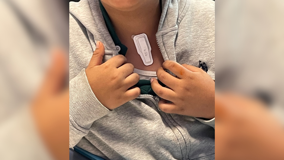 child in little havana with one of the sensors designed for the music for childhood well-being initiative