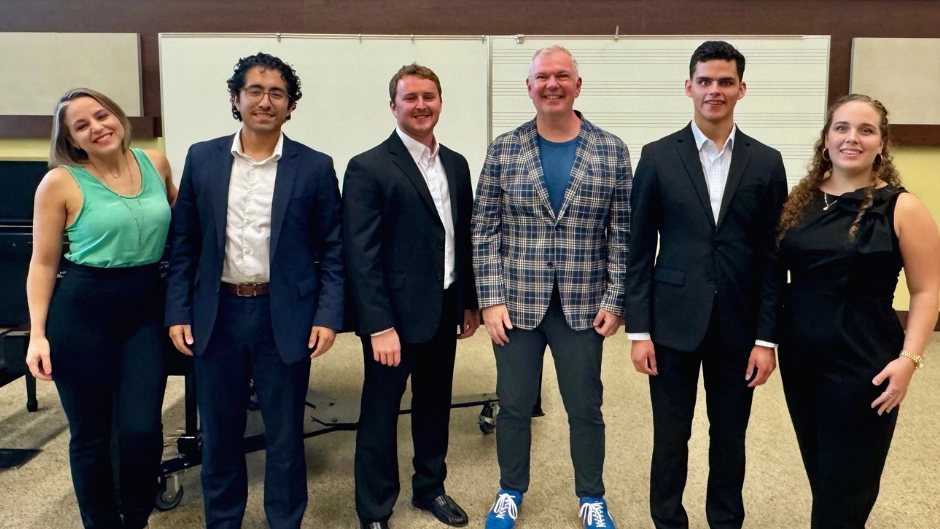 Resident guest artist Craig Terry with (l. to r.) Jenny Snyder, musical director of the Frost Opera Theater, and students Brandon Flores, Chris Melton, Sylvio Plata, and Naysa Marrero.