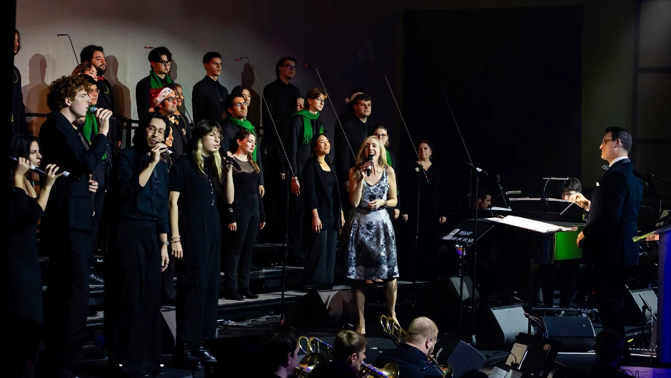 Frost School jazz vocal program leader Kate Reid sings Gloria Estefan's "Christmas Through Your Eyes" with vocal students, with Matthew Brady, director of choral studies, conducting.