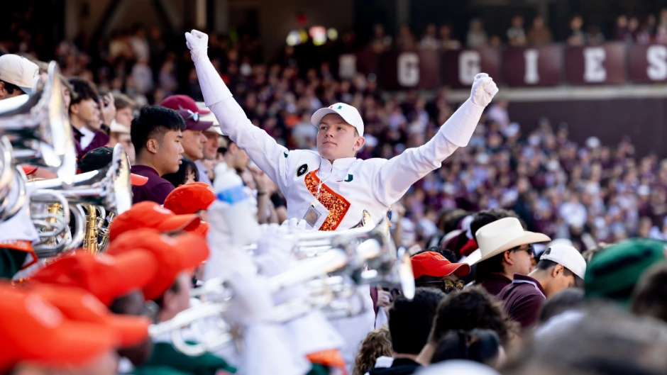 Frost Band of the Hour drum major Noah Booz’s father was in the marching band when the Hurricanes won the national title in 1987. Photo by Joshua Prezant/University of Miami.