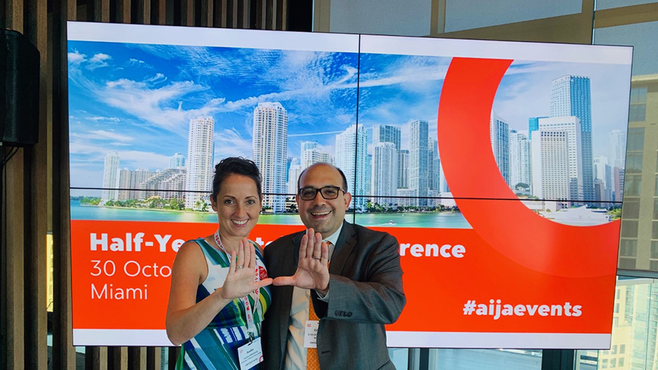 Sandra Friedrich and Eduardo de la Peña at the AIJA Half-year Conference after announcing the scholarship collaboration.