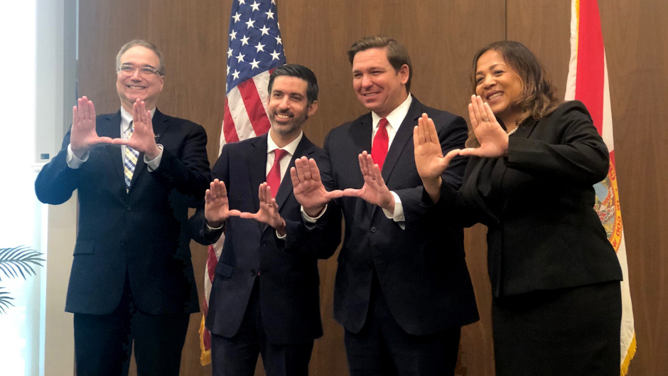 Picture of Dean Anthony Varona, Judge Ramiro Areces, Gov. DeSantis, and Ayana Harris