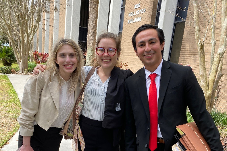 Immigration Clinic students Ashley Plotkin, Abbey Schultz, & David Mancia-Orellana