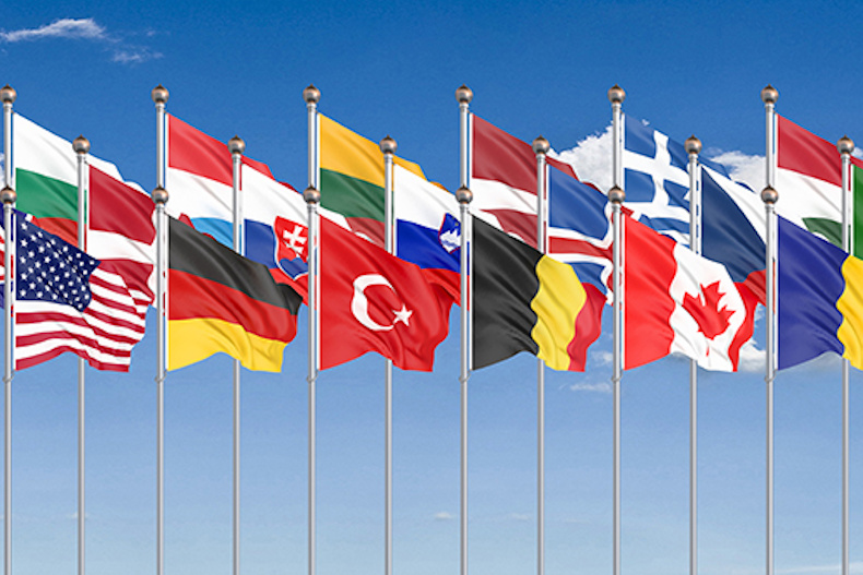 Group of international flags waving in the wind